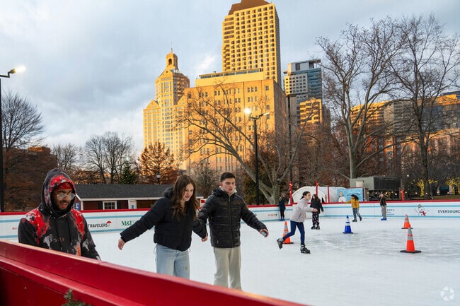 Folks skate for free on the ice rink at Winterfest in Downtown Hartford, an annual event.