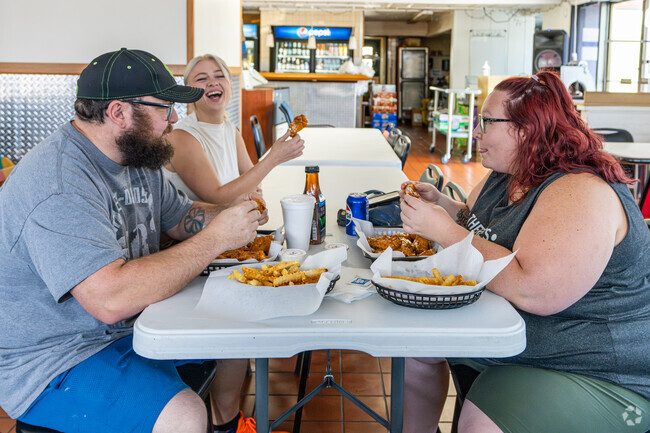 Friends gather for a meal at the Waterfront Café in Decatur's Lost Bridge neighborhood.
