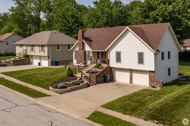 Raised ranch homes with two car garages and large yards line the streets of Liberty.