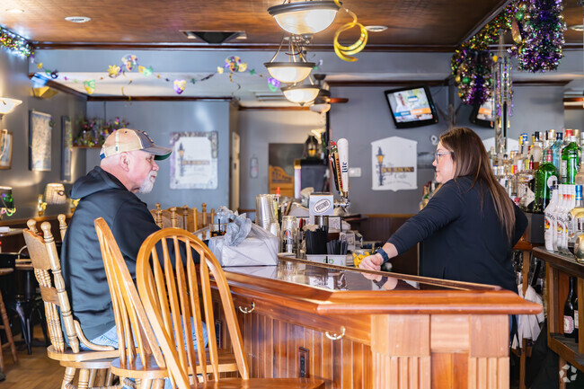Residents enjoy a cold drink and a hot lunch at Baltimore Street Grill in Cumberland.