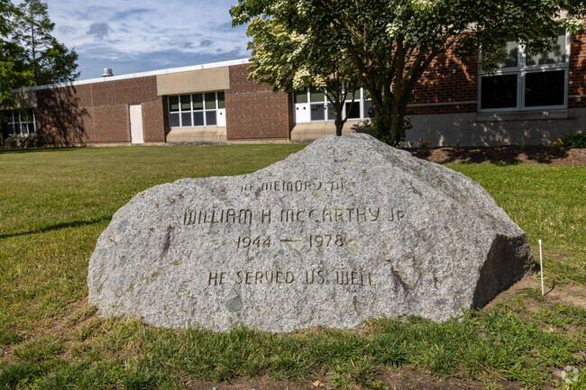 A stone commemorates William H McCarthy Jr. At Whitman Middle School in Whitman.