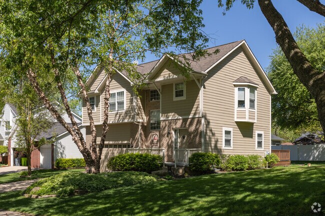 Colonial-style homes sit on large lots in West Bloomfield.