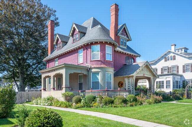 This spacious Victorian home, featuring wood shingle siding, overlooks Clasky Park.