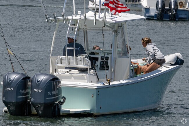Off for a leisurely tour of Cape Cod, boaters enjoy the hospitality of Barnstable Village.