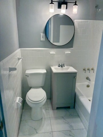 Newly Updated Bathroom with vanity, mirror and lighting