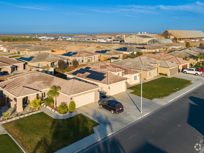 Many early 21st century homes have been built on the West side of McFarland near farmland.
