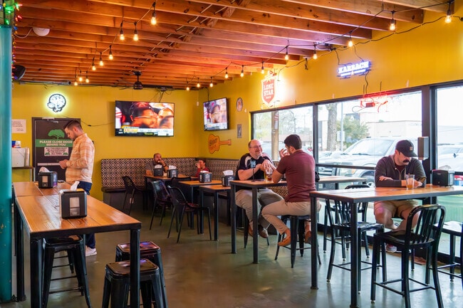 Locals socialize at Lazy Oaks Beer Garden in Spring Branch West.