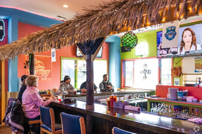 Port of Blarney near Newport Cove is a waterfront restaurant with a tiki-themed bar.