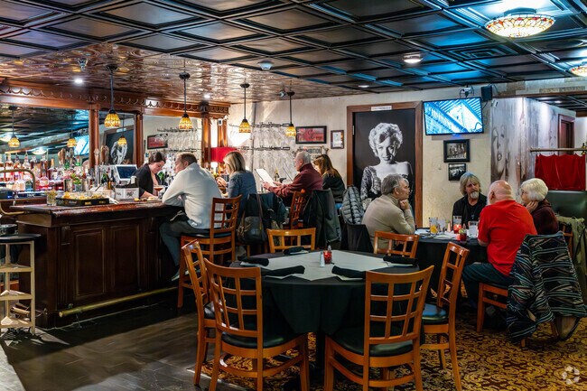 Guests enjoy the cozy atmosphere at Alexander Pierce Restaurant.