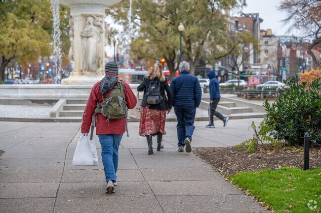 People taking a stroll through Dupont Circle.