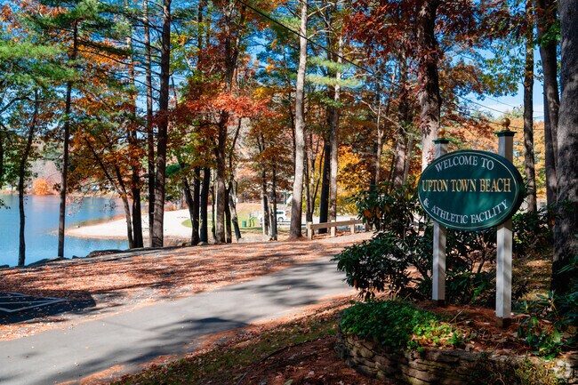 Upton Town Beach welcomes you in to relax with a spectacular view of Pratt Pond.