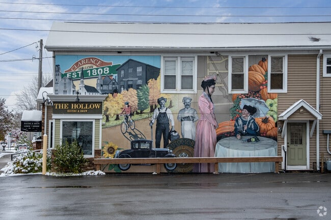 A mural depicting the history of Clarence adorns the facade of The Hollow Bar & Bistro.