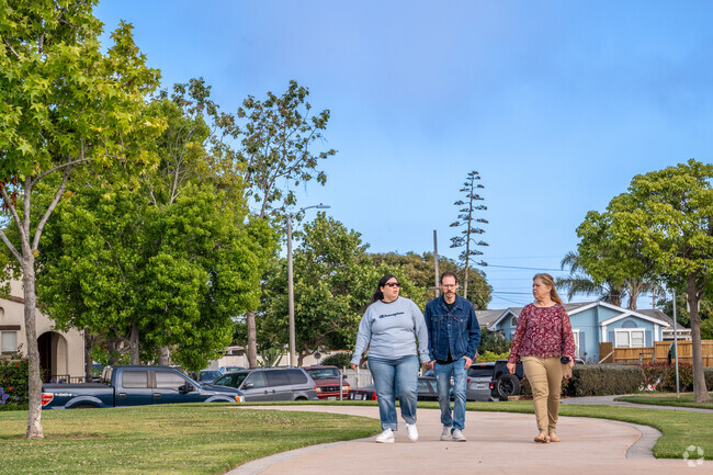 Enjoy a walk with friends along the one third mile loop path at Vineyards Park.