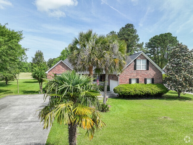 Goose Creek has spacious homes with lovely landscaped lawns and palmetto palms.