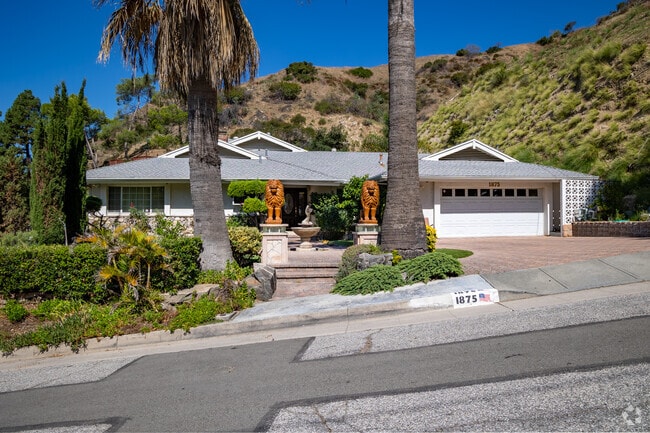 In Glenwood, homes are surrounded by lush greenery and the elegance of palm trees.