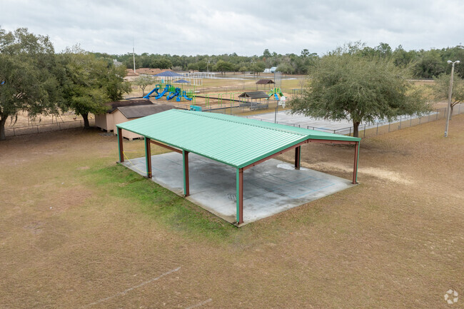 A covered play area offers students options in the summer heat.