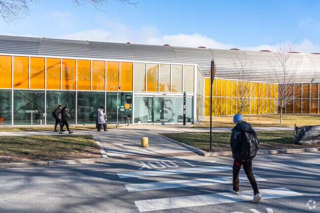 Students see Mies van der Rohe's face as they walk past the student center in Stateway Gardens.
