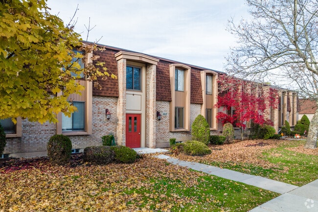This unique apartment complex features a cute architectural design of red doors.