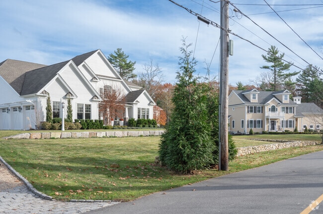 A craftsman and colonial home line the streets of Norwell.