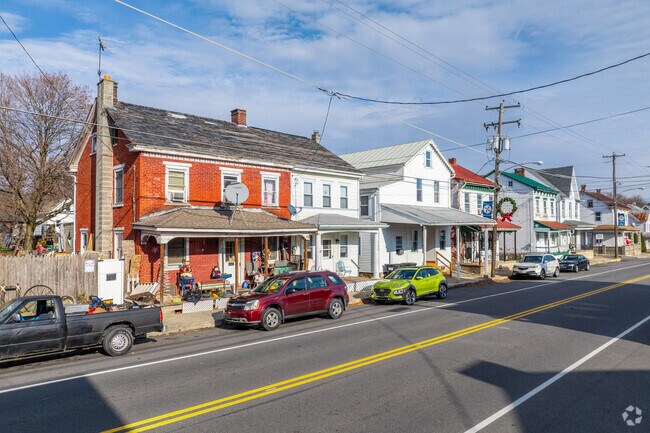Rows of colonial single family homes and duplexes line Main Street in Upper Bern.