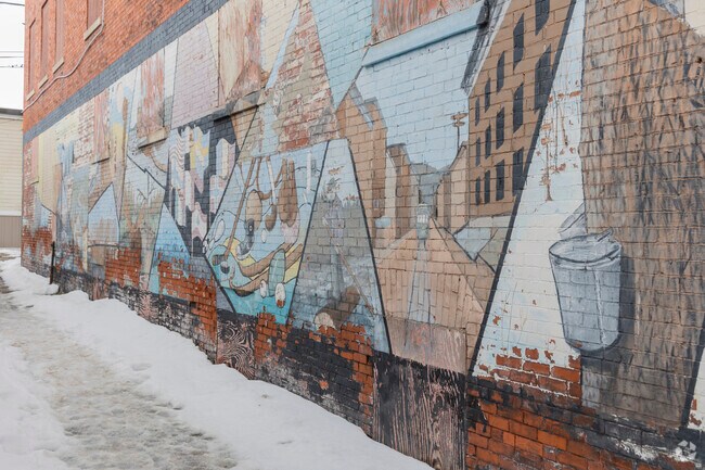 A mural in Downtown Berlin created by a local artist depicts the towns industrial roots.