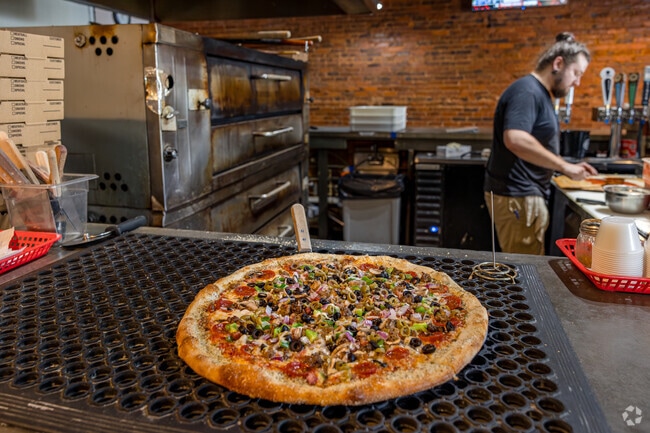 Grab a pizza, drinks or a calzone from Lovin' Oven Pizzeria in Locust Grove.