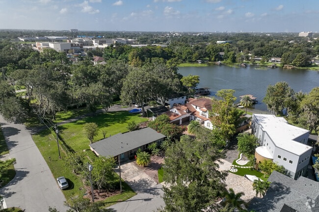 An adorable, aerial view of modern style properties residing on Lake Jasmine.