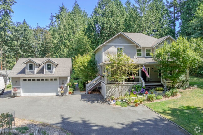 A stunning contemporary traditional home surround by lush forest in Hansville WA.