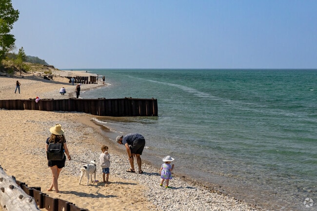 The rocky beach at Point Betsy Lighthouse is perfect for families with curious kids.