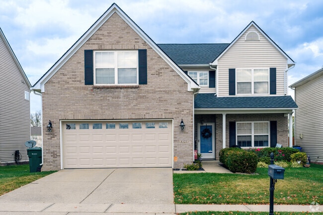 This two-story home in Boone Creek East offers a two-car garage and ample windows.