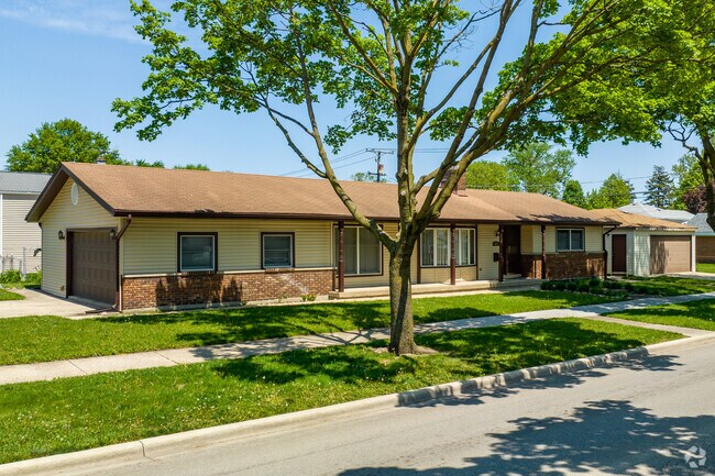 Ranch style houses with attached garages and yard space can be found in Forest View.