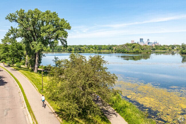 Bikers can enjoy a ride around Lake of the Isles with both lake and city views.