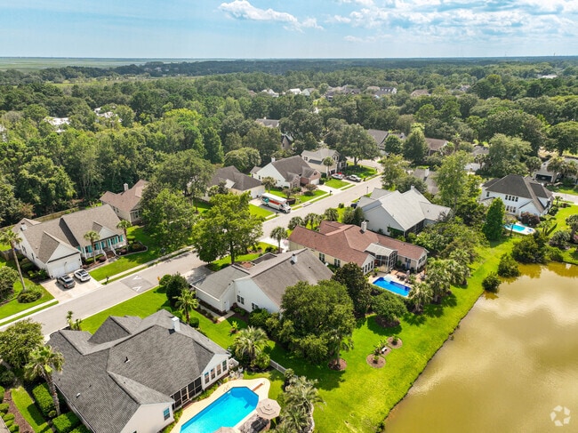 Some Charleston National homes include refreshing pools in the backyard.