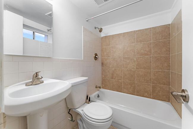 Full bathroom with vanity, tub & shower; ceramic tile flooring&medicine chest