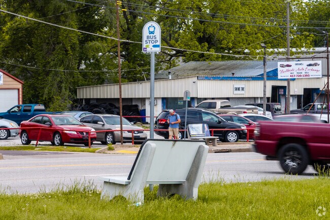 Bus stops line Kearney Street along Tom Watkins' northern edge.