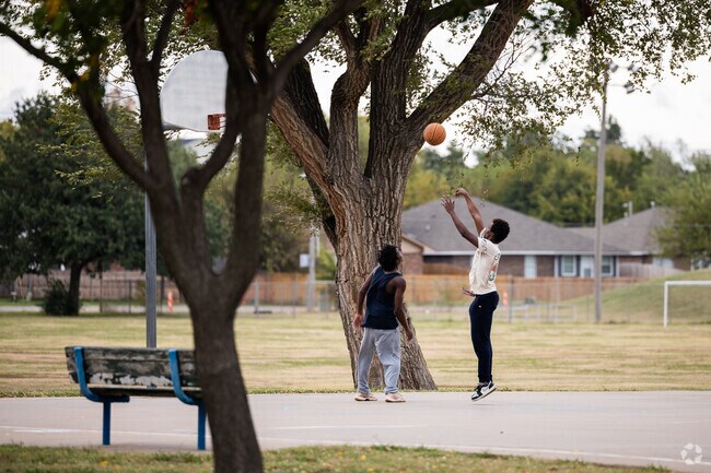 These locals are enjoying a game of basketball at Booker T Washington Park in John F Kennedy.