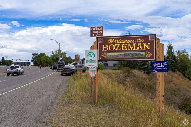 A hand carved sign welcomes Bogert Park visitors to the town of Bozeman.