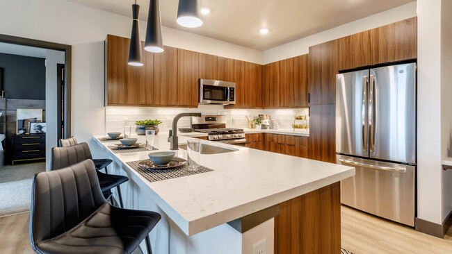 Kitchen with Breakfast Bar and Stainless Steel Appliances