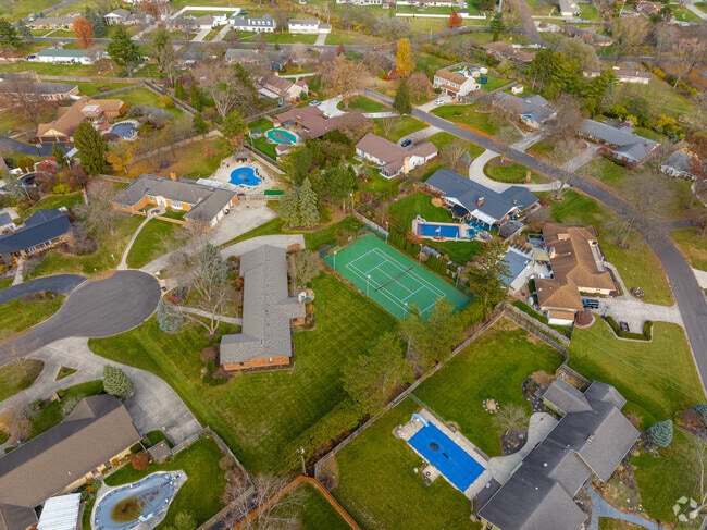 Most of the homes in Fort Wayne's Hacienda Village feature fenced in yards with swimming pools.
