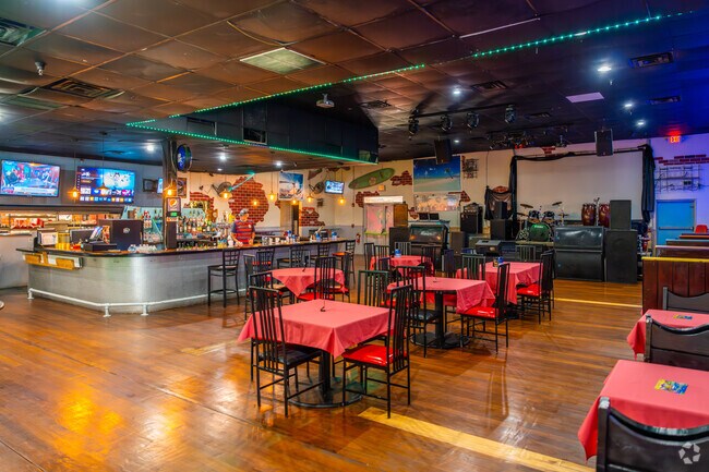 Interior of Los Cocos restaurant offering live music.