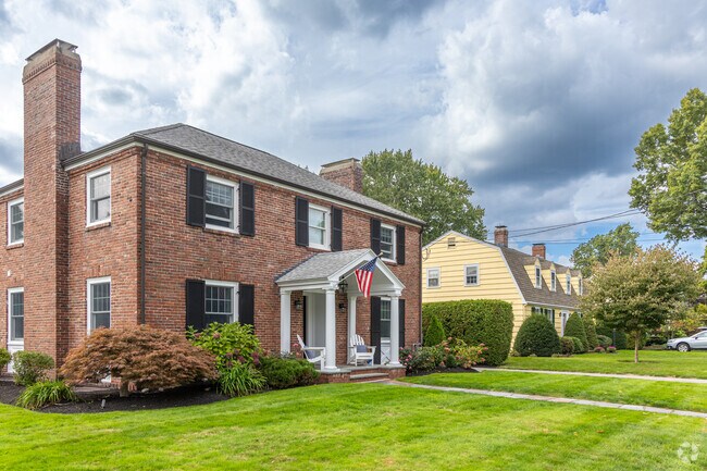 A row of homes including a Colonial Revival styled in West Side of Winchester, MA.