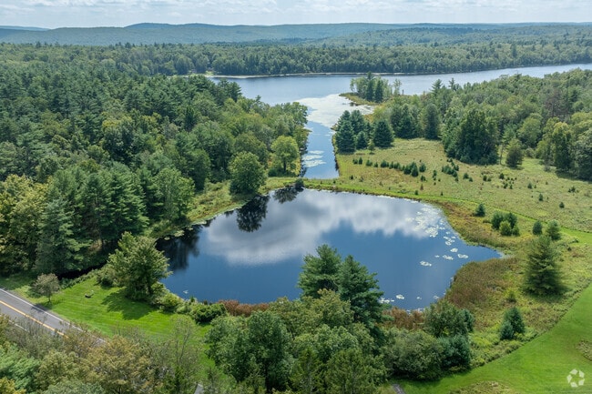 Networked by a labyrinth of streams & ponds, Wawarsing wraps most of the way around Ellenville.
