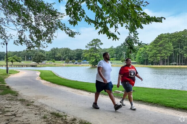 Enjoy the scenic views on the walking path at Olive Branch City Park.