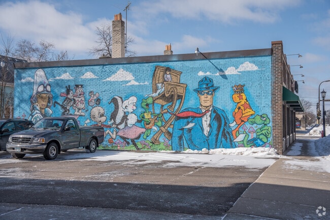 A colorful mural brightens the alley behind DreamHaven Books in Standish.