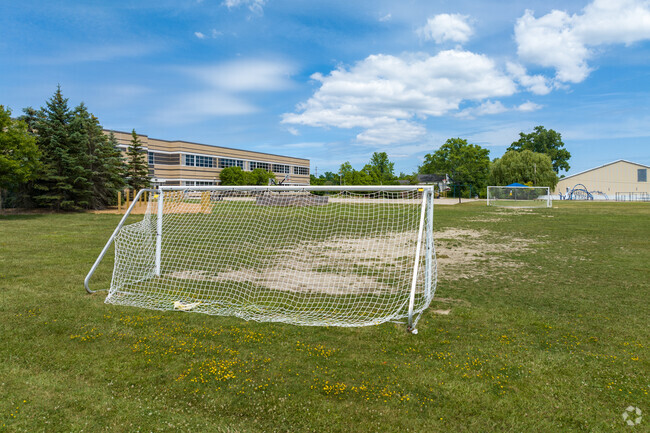 Score a goal on the soccer field at Beverly Elementary School.