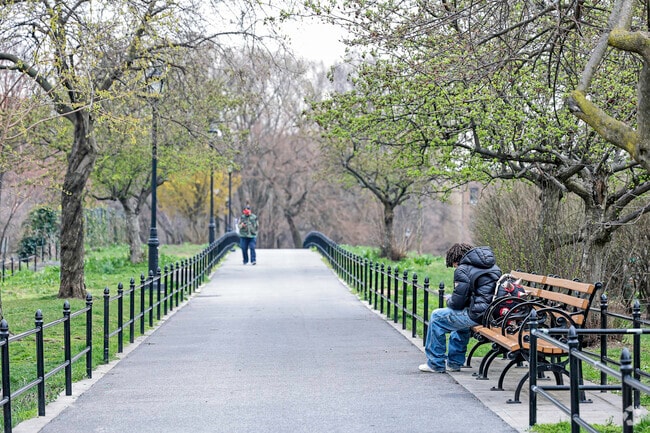 Locals enjoying a beautiful day at Aqueduct Walk in the University Heights community.