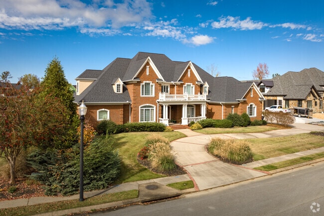 Large brick homes are scattered throughout the Hamilton Place neighborhood.
