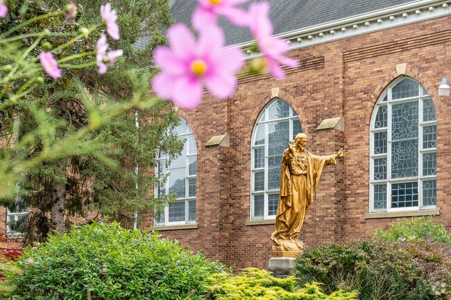 A statue of St. Dominic stands in the courtyard of Holy Name Church in Steelton.