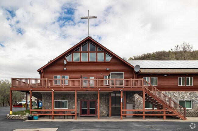 Crossroads Uintah Campus is a church located in a charming log cabin.