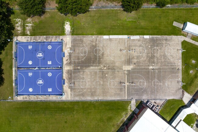 Aerial of sports courts at Neptune Middle School in Neo City.